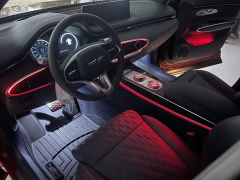 Genesis GV70 cabin with red seats and fresh floor liners