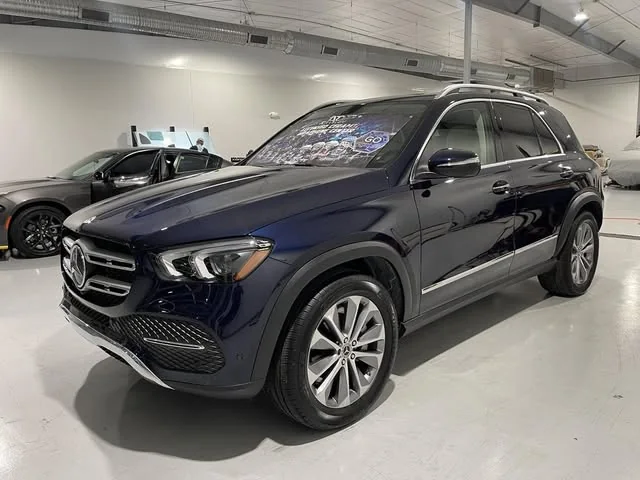 Navy Mercedes GLE with a coating banner on the windshield