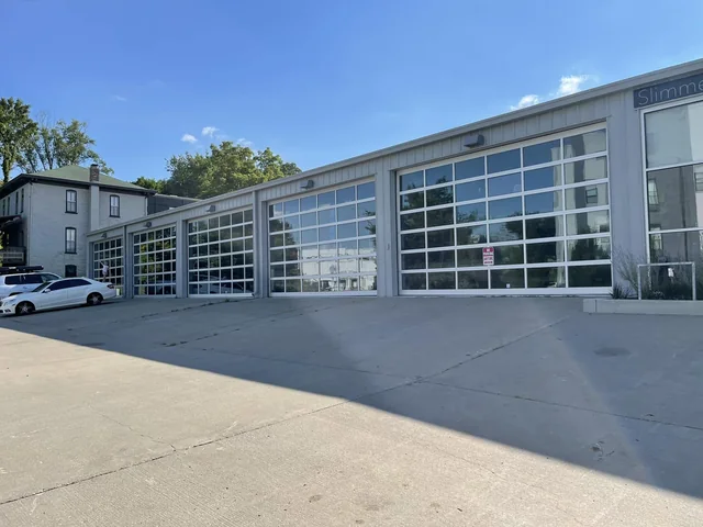 Glass garage doors of the shop building on Delaware Street